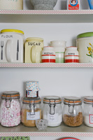 Storage jars on kitchen shelving