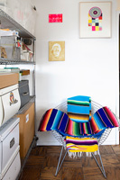 Metal chair with colourful throws