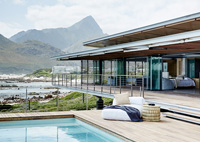 Contemporary house and pool overlooking the sea