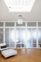 Modern open plan apartment with glass doors