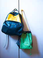Handbags hanging from wardrobe door