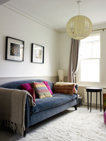 Colourful throws and cushions on grey sofa