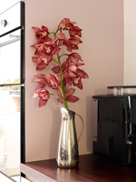 Pink Orchid flowers in silver jug