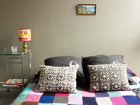 Crochet cushions on bed