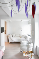 White living room with sofa bed