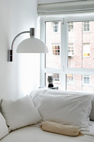 Wall mounted lamp above sofa bed