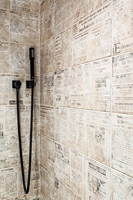 Patterned tiles in shower cubicle