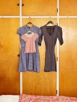 Dresses hanging above wardrobe doors