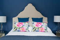 Floral cushions on bed