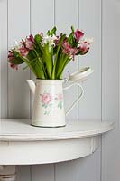 Arrangement of Alstromeria and Hyacinth flowers in floral jug
