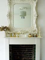 Ornate mirror above fireplace