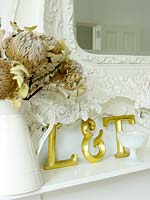 Gold letters on mantlepiece