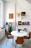 Colourful art display in dining room