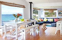 Colourful open plan dining room with sea view