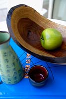Apple in rustic wooden bowl