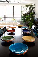 Colourful crockery on dining table