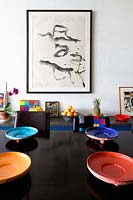Colourful crockery on dining table
