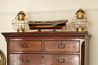 Nautical accessories on chest of drawers