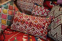 Colourful soft furnishings on sofa