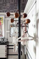 Eclectic accessories on coat hooks