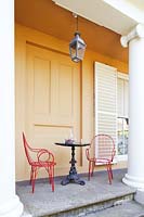 Colourful furniture on veranda