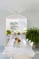 Floral display on white dining table