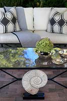 Glass coffee table on veranda