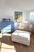 White armchair in bedroom corner
