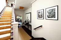 Black and white photography in entrance hall