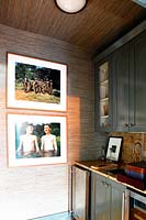 Framed photos on kitchen wall