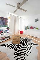 Zebra print rug in childs bedroom