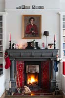 Christmas decorations around period fireplace