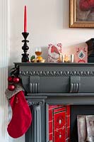 Christmas decorations around period fireplace