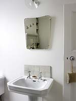Vintage mirror above bathroom sink