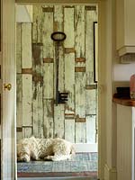 Distressed wooden panelling in hall