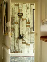 Distressed wooden panelling in hall