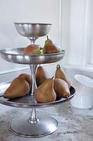 Pears on metal cake stand