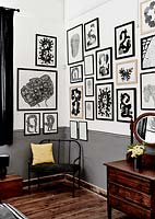 Monochrome art display on bedroom wall