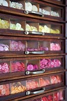 Buttons in vintage display cabinet