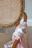 Childs dress on patterned chair