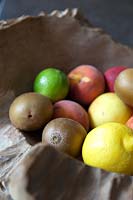 Fresh fruit in rustic wooden bowl