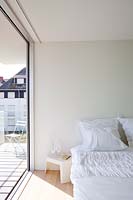Minimal bedroom with balcony