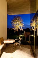 Contemporary patio lit up at night