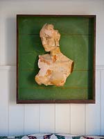 Wall mounted bust above bed
