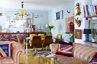 Eclectic open plan living and dining rooms