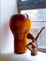 Wooden vase and pottery figure