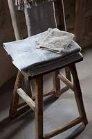 Towels on rustic wooden chair