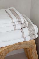 Towels on wooden stool