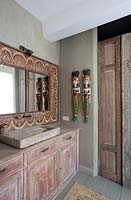 Wooden cabinets under stone sink
