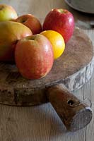 Apples on rustic chopping board